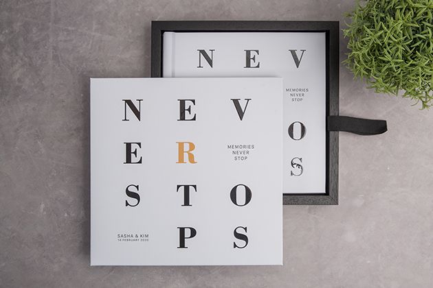 Two minimalist typography prints with black letters spelling 'NEVER STOPS' against white backgrounds.