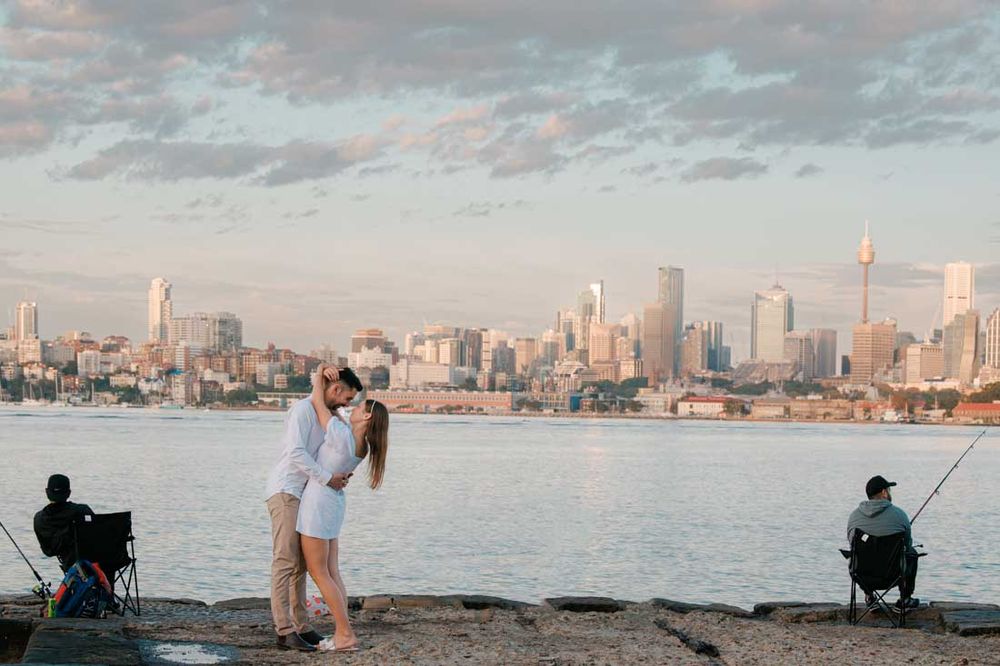 Scenic Sydney Harbour engagement photos with city skyline and bridge views.