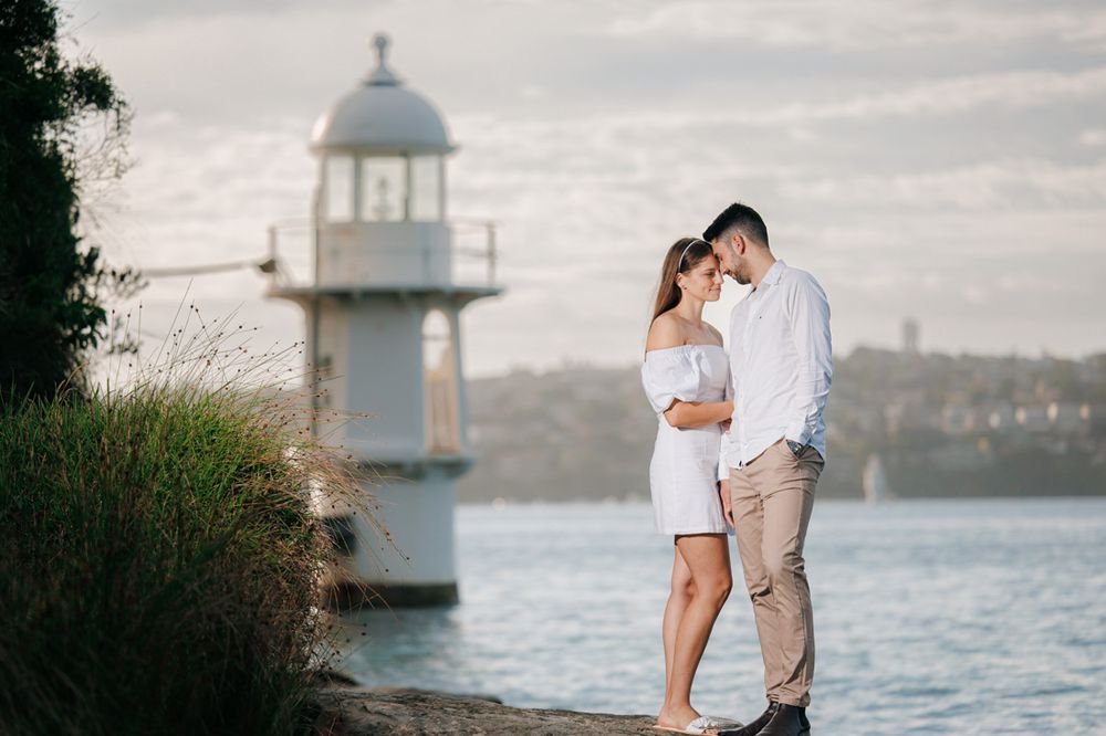 sunrise couple photos in Sydney with lighthouse in the background