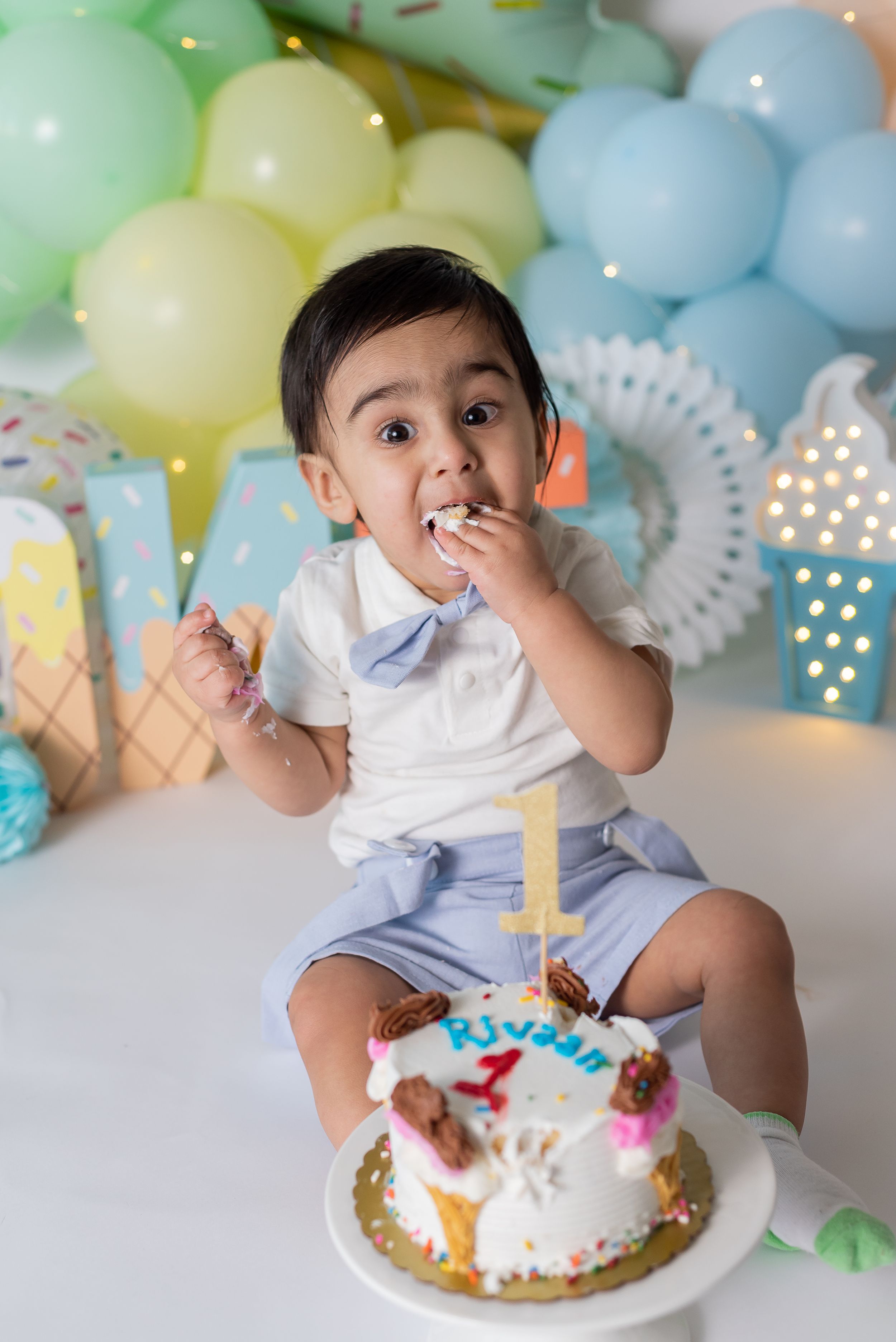 First birthday cake smash session with Lively Ella Photography we can add balloons and festive decor.