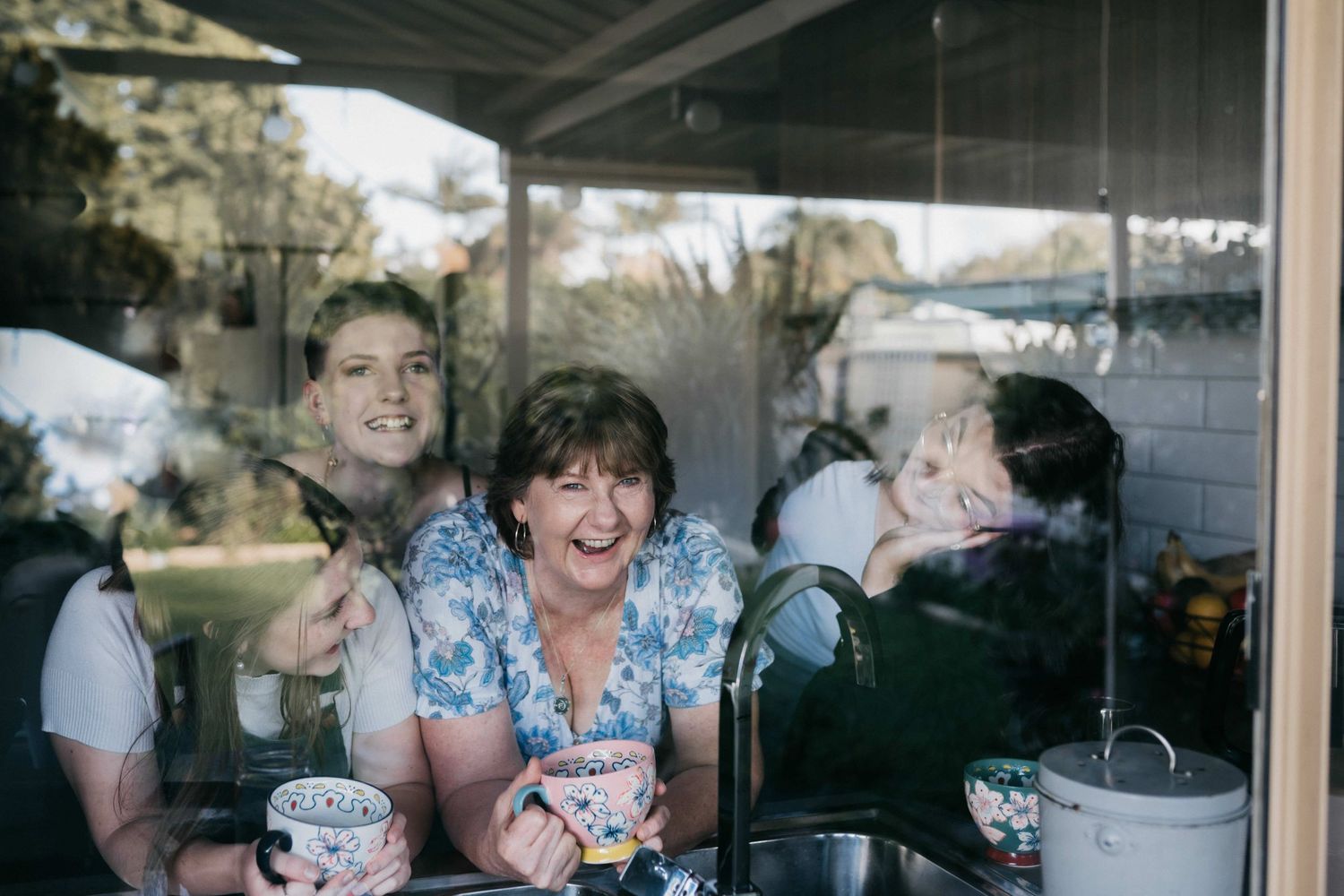 Mother and daughters relaxed in their home family photo session