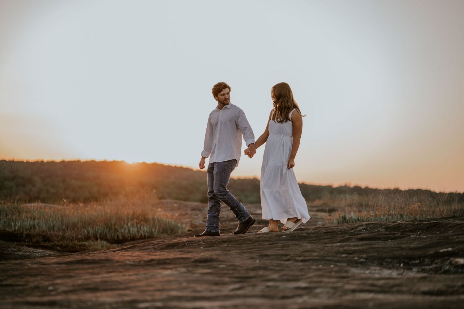 bride and groom sunset engagement photo session. Arabia Mountain, Atlanta Georgia