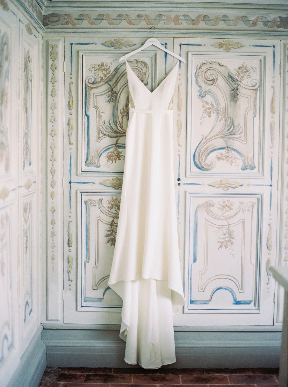 Wedding dress set in the beautiful historical interior of La Foce, Tuscany.