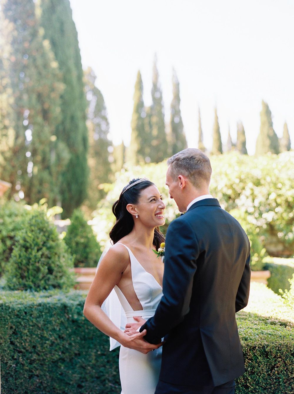 Wedding photographer capturing a beautiful moment of first look at La Foce in Tuscany.