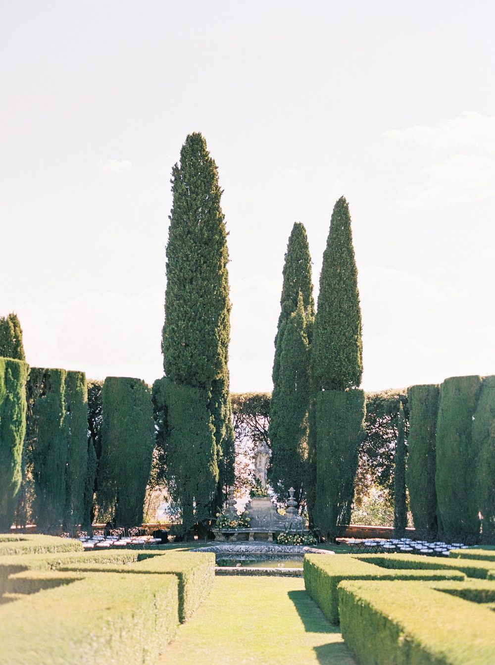 A beautiful outdoor wedding ceremony setting in garden of La Foce, Italy