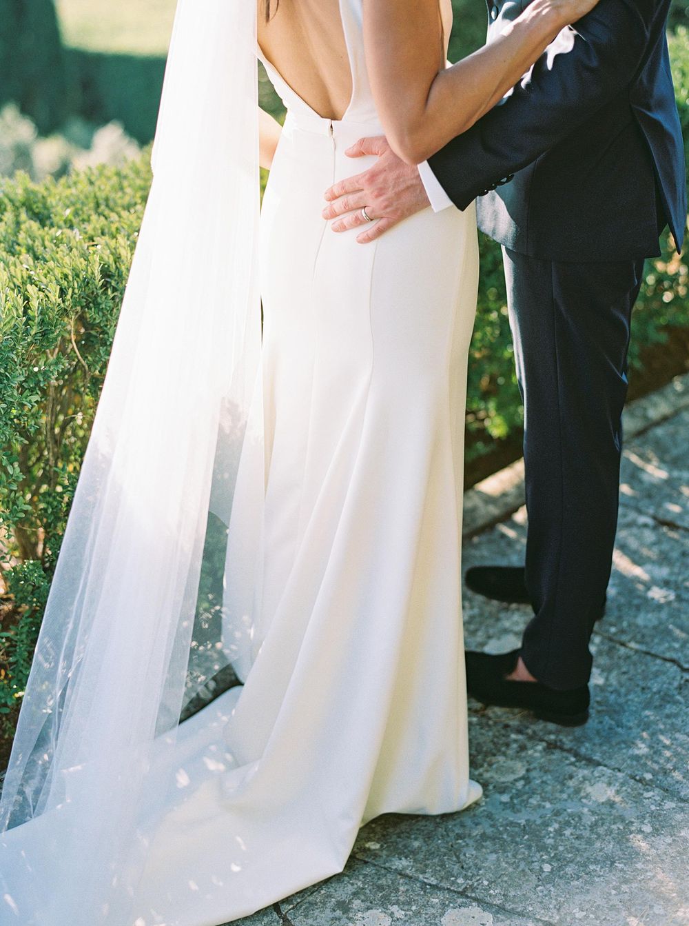 Wedding photographer capturing a beautiful moment between a bride and groom in the picturesque region of Tuscany.