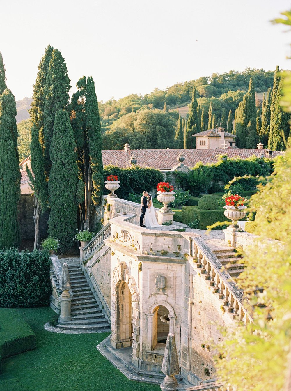 A romantic wedding in Tuscany, Italy. The bride and groom captured in a garden at La Foce.