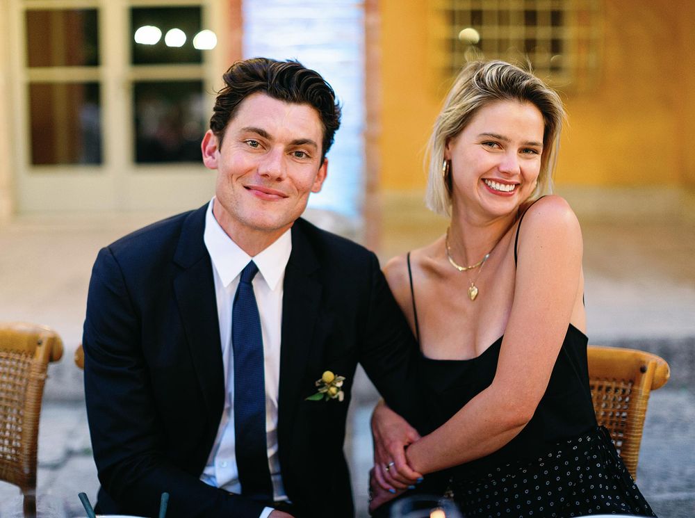 Smiling guests at wedding reception.
