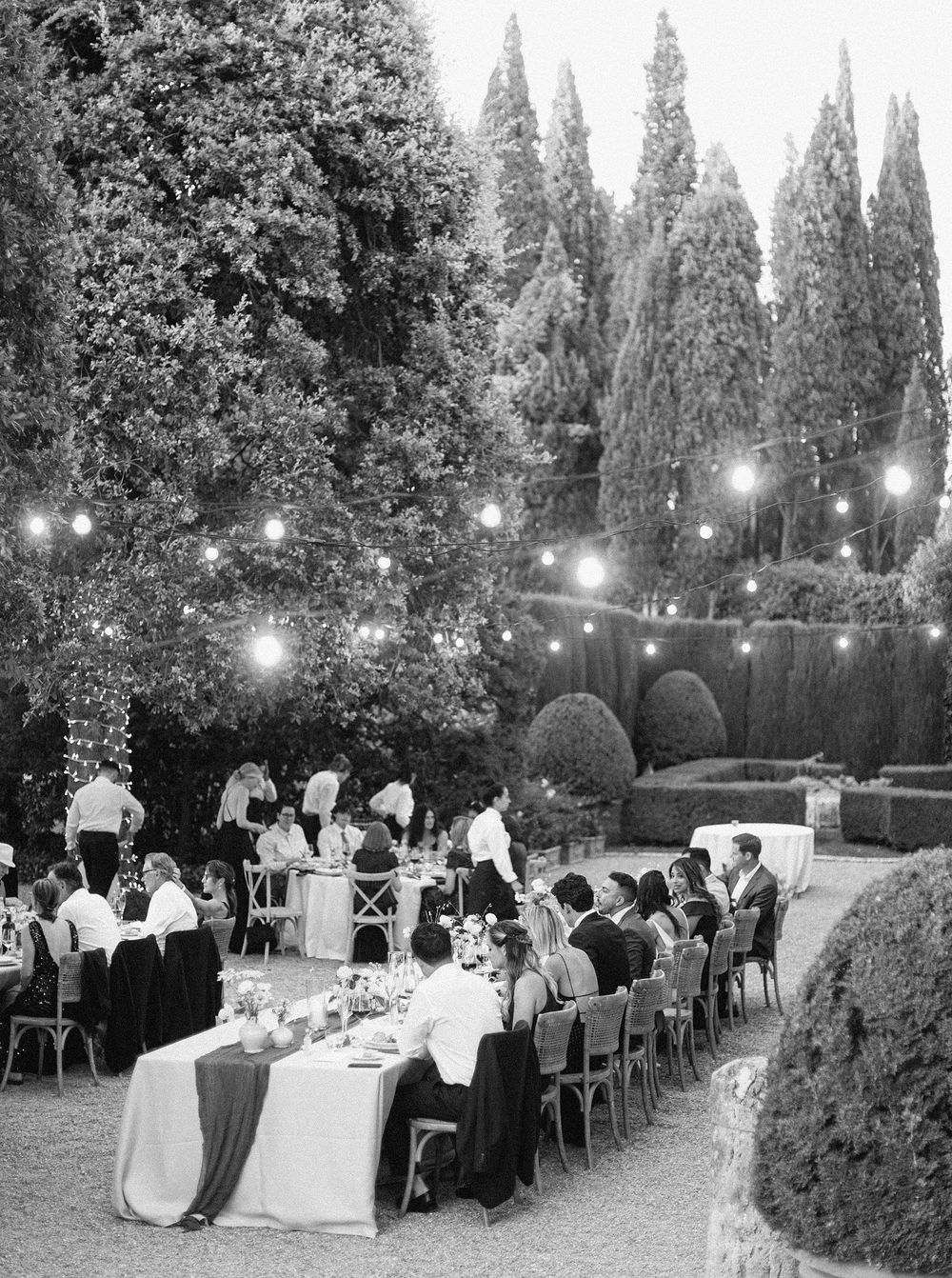 A monochrome image capturing a wedding reception, showcasing the elegance and joy of the event.