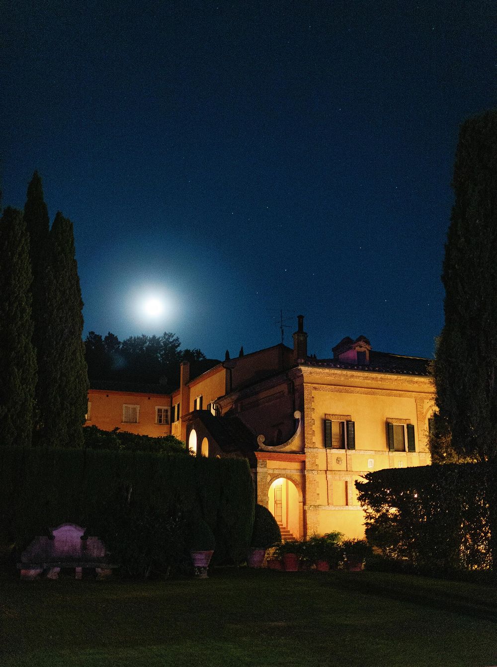 The full moon casts a magical glow on the beautiful villa, La Foce, in Tuscany.