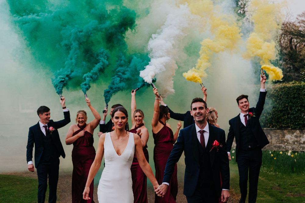 Bridal party with smoke bombs at a Gilmerton house wedding