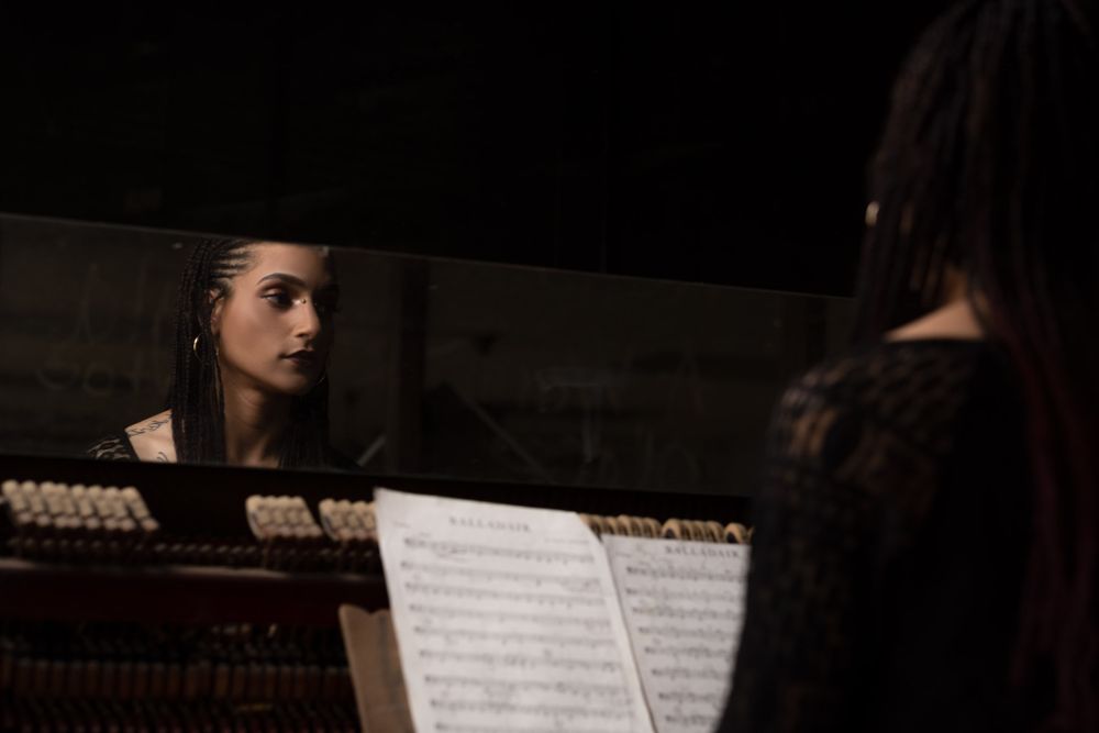 Beautiful Portrait of a woman sitting at a Piano