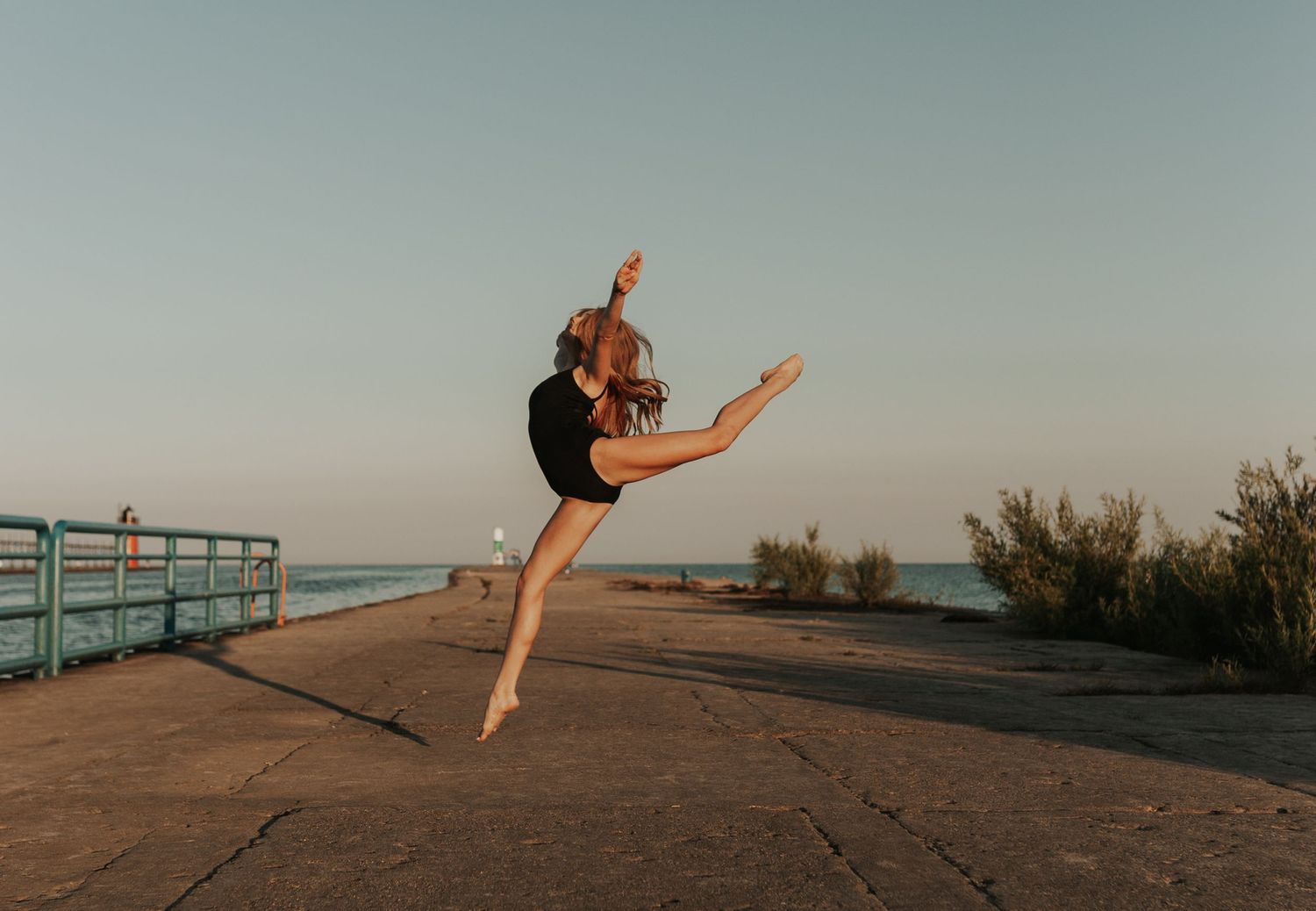 Senior photo dancer on south haven pier Michigan
