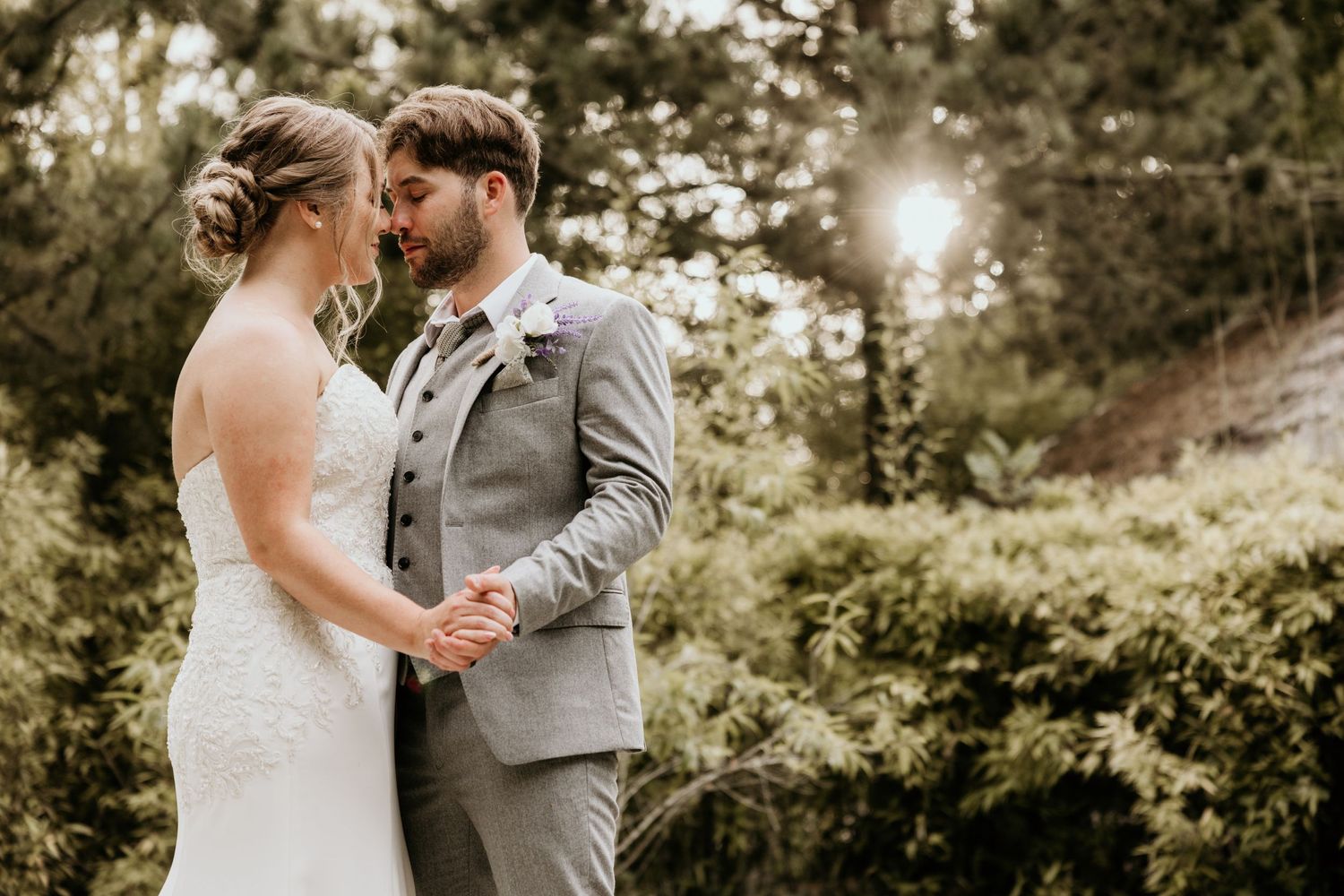 bride and groom holding hands in garden in spalding