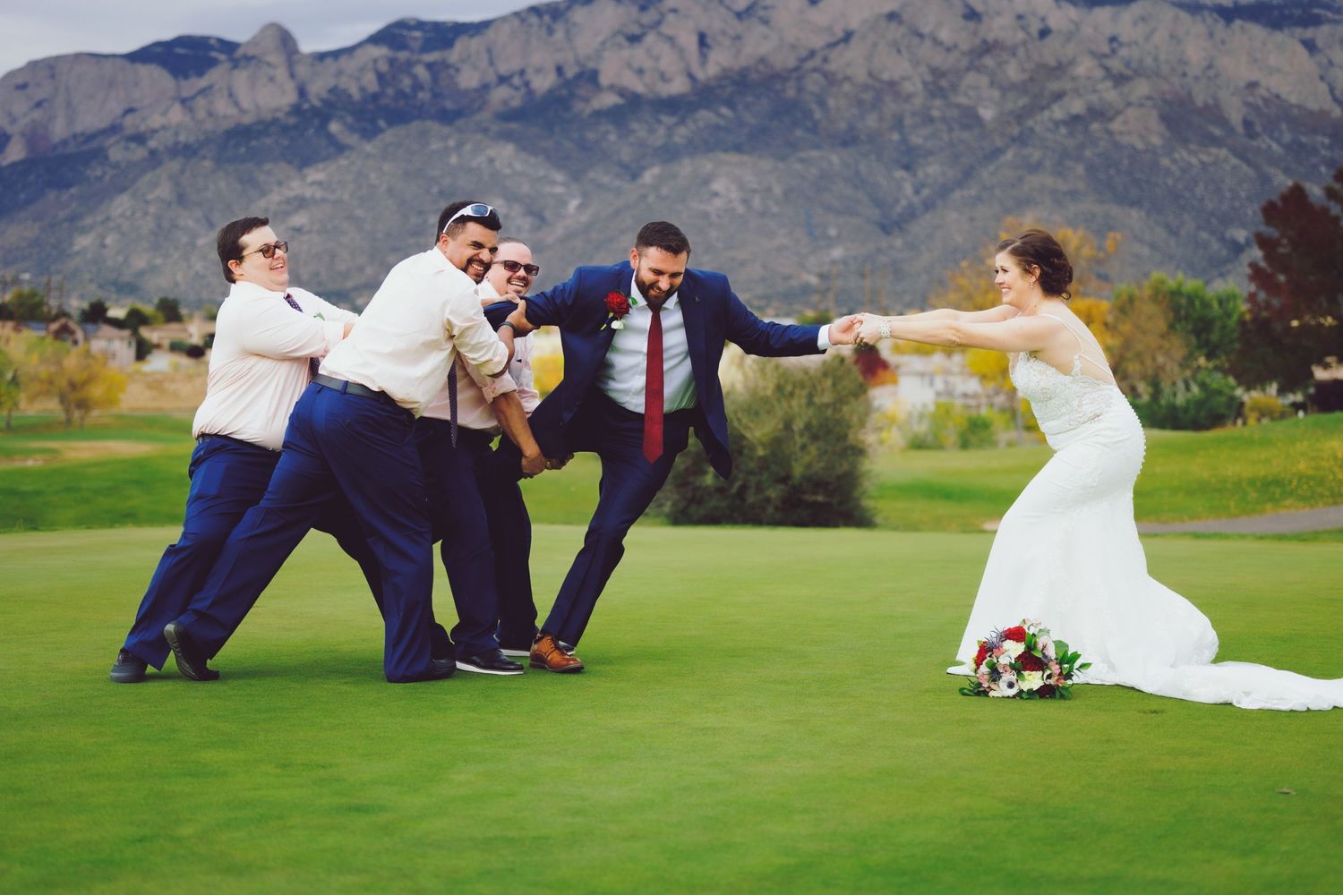 Bride stealing Groom from groomsmen