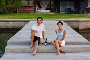 sitting on wood wharf