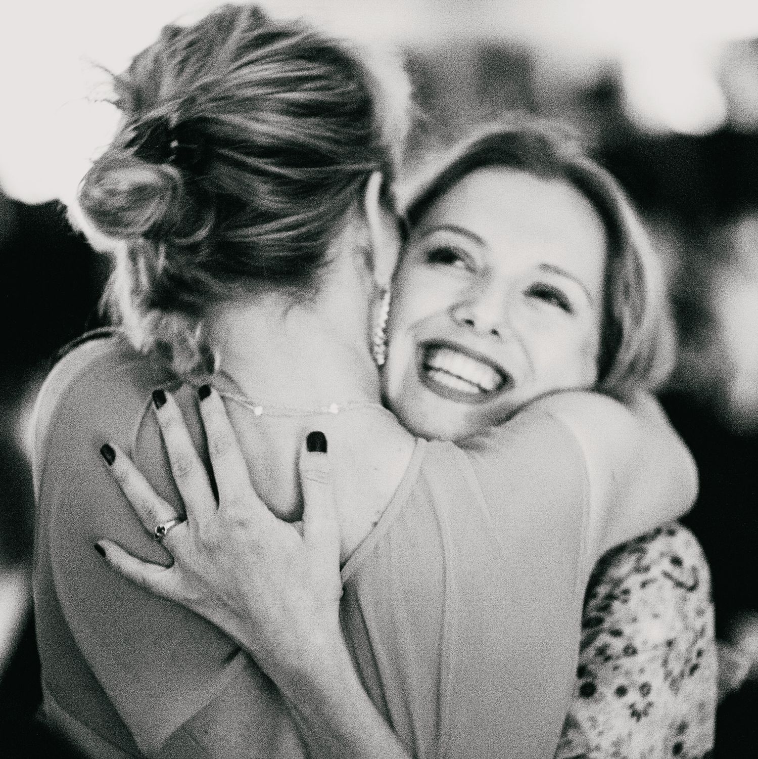 Collection of joyful embraces and candid moments captured in black and white photography.