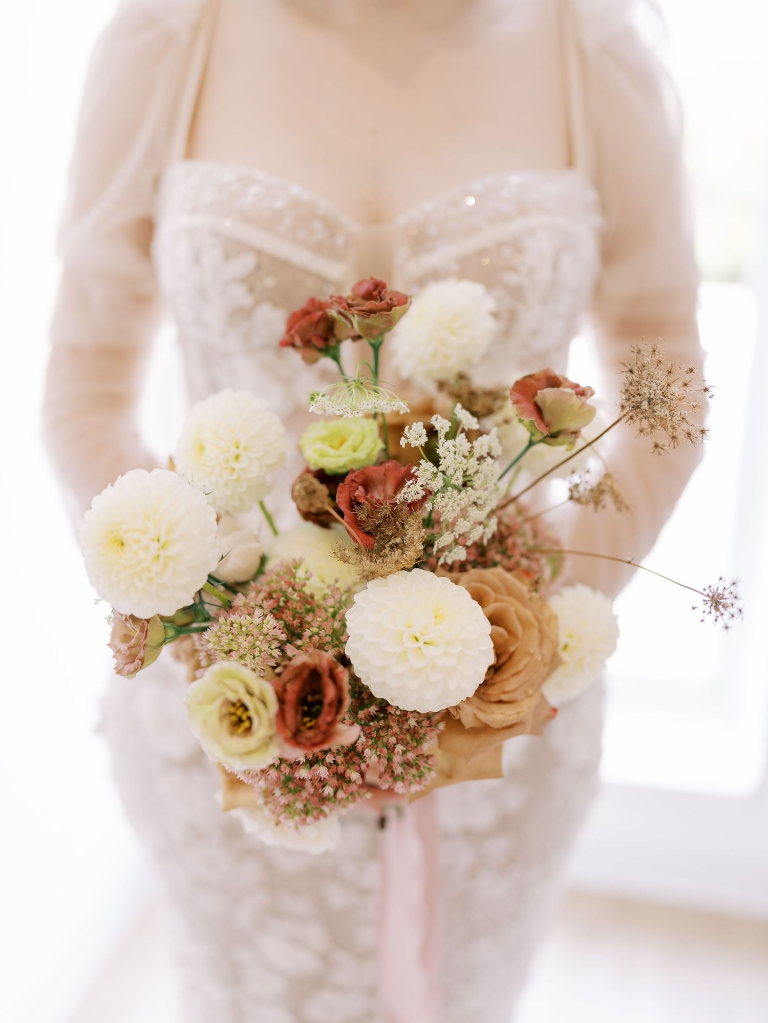 Close up of bridal portrait with a fall color wedding bouquet. Classic and film-inspired wedding photography in Madison, Wisconsin.