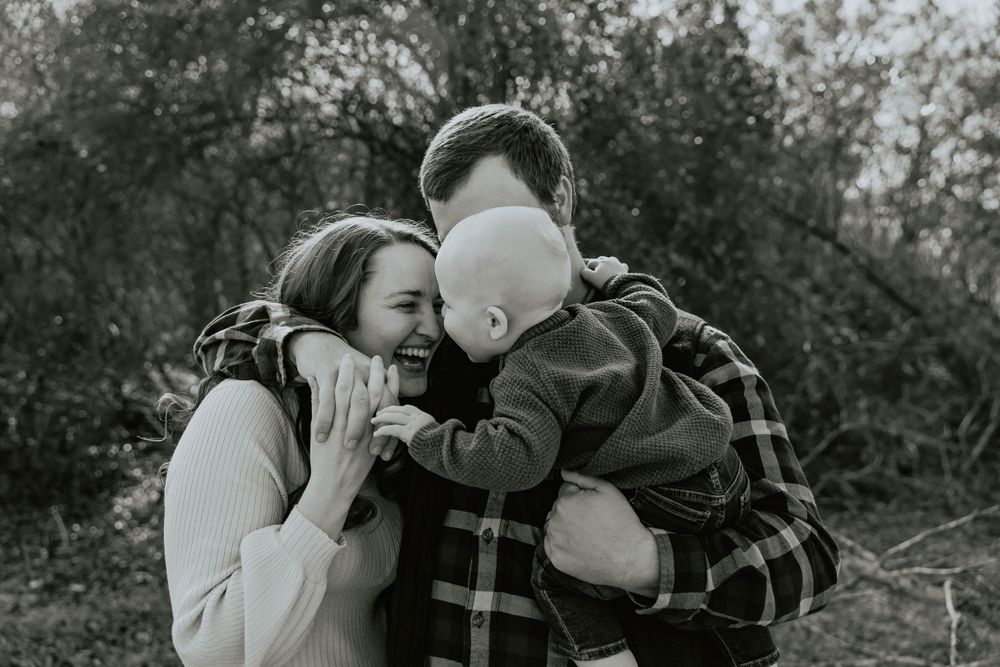 Black and white series of candid family moments captured outdoors in natural setting.