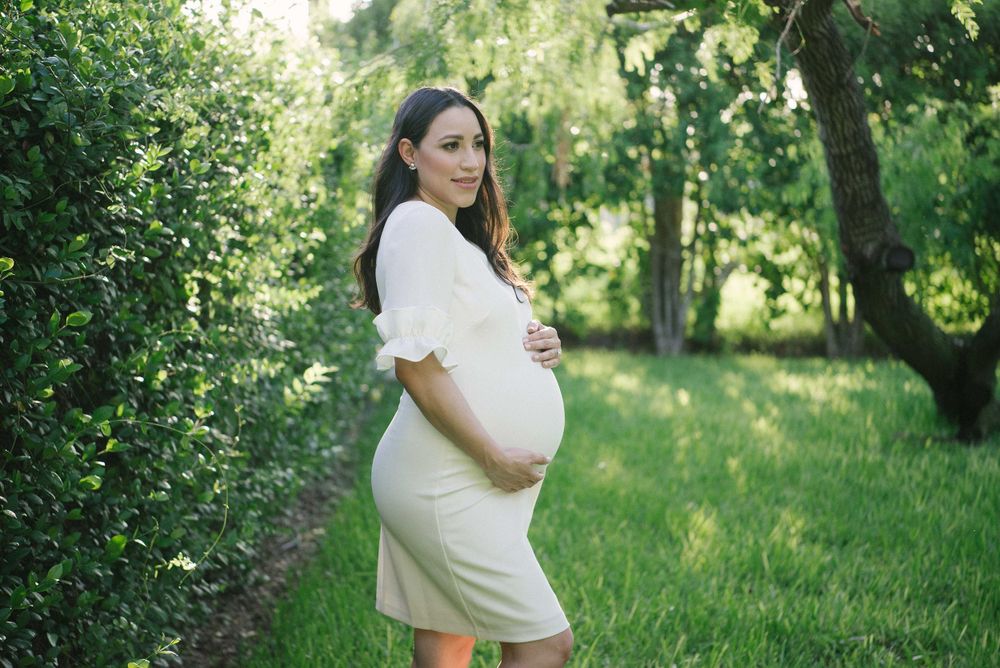 girl holding belly. white dress. prenatal session. pregnancy photos. mcallen, Texas. wedding photography