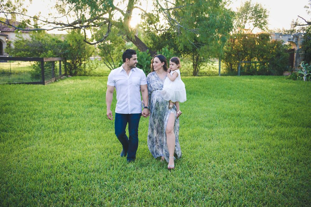 couple walking together. prenatal session. pregnancy photos. mcallen, Texas. wedding photography