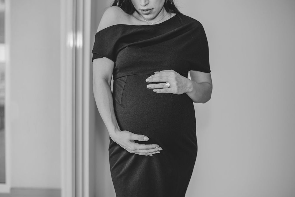 black and white girl holding belly. prenatal session. pregnancy photos. mcallen, Texas. wedding photography