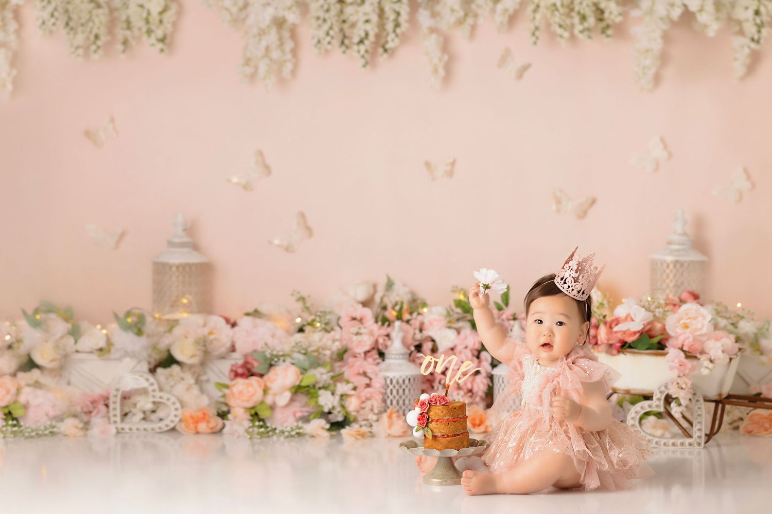 simple floral white and pink cake smash, baby girl first birthday photoshoot, los angeles california, best photographer