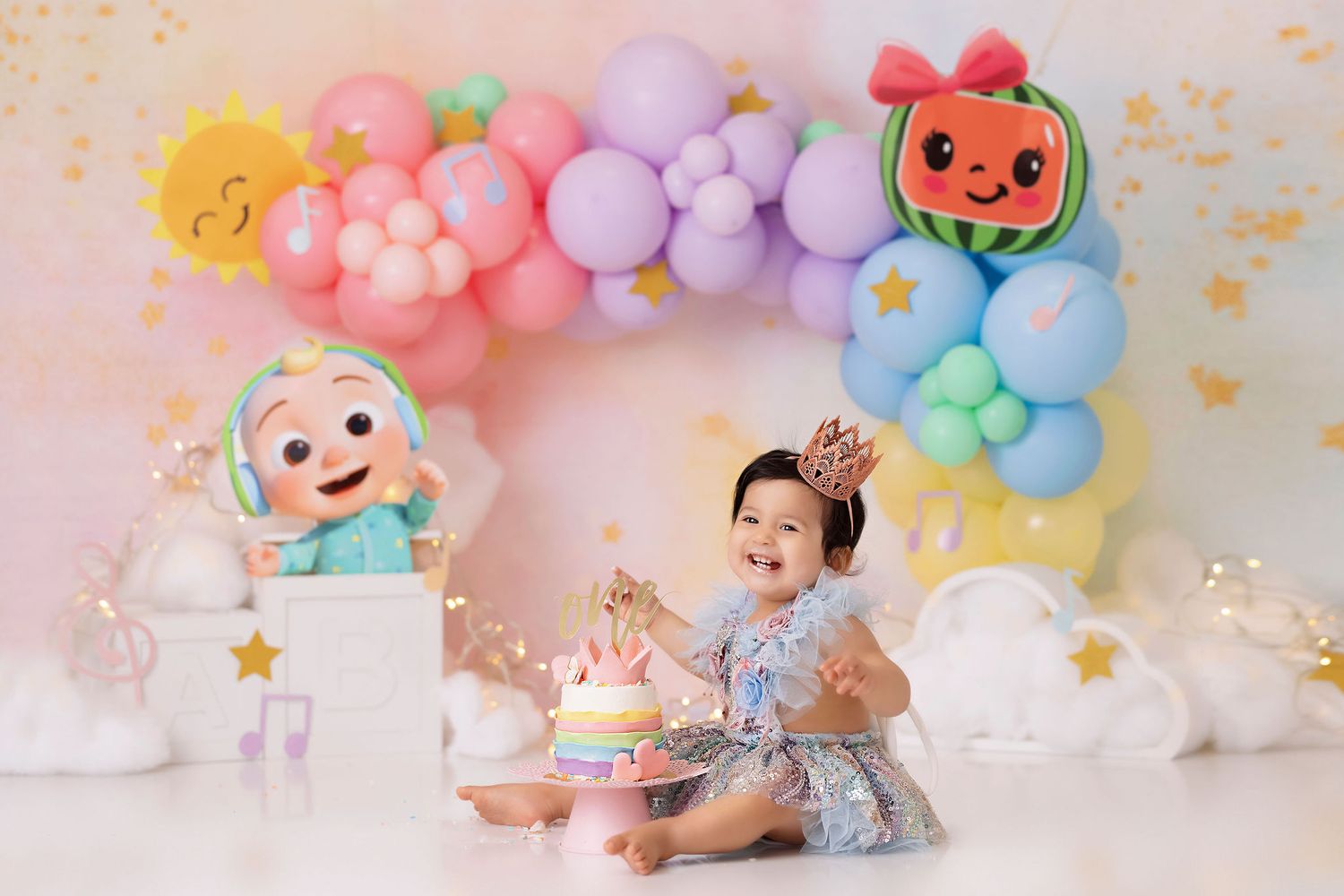 pastel cocomelon rainbow cake smash, baby girl first birthday photoshoot, los angeles california, best photographer