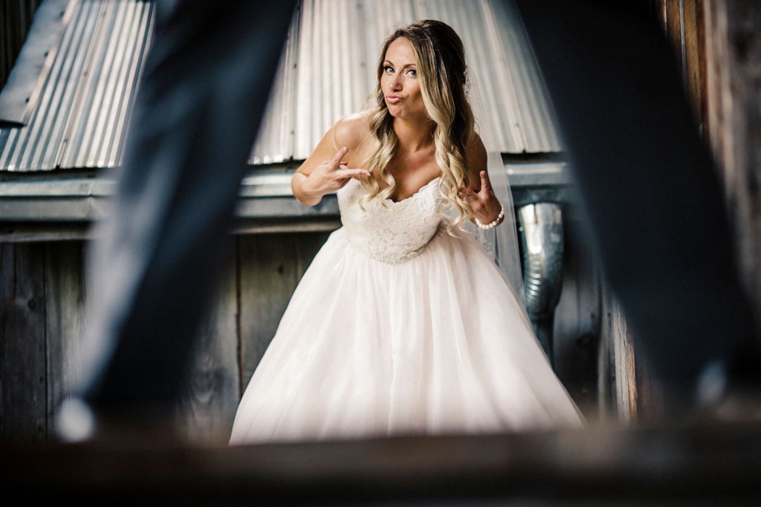 Artistic bridal portraits through window frames creating dramatic framing effects.