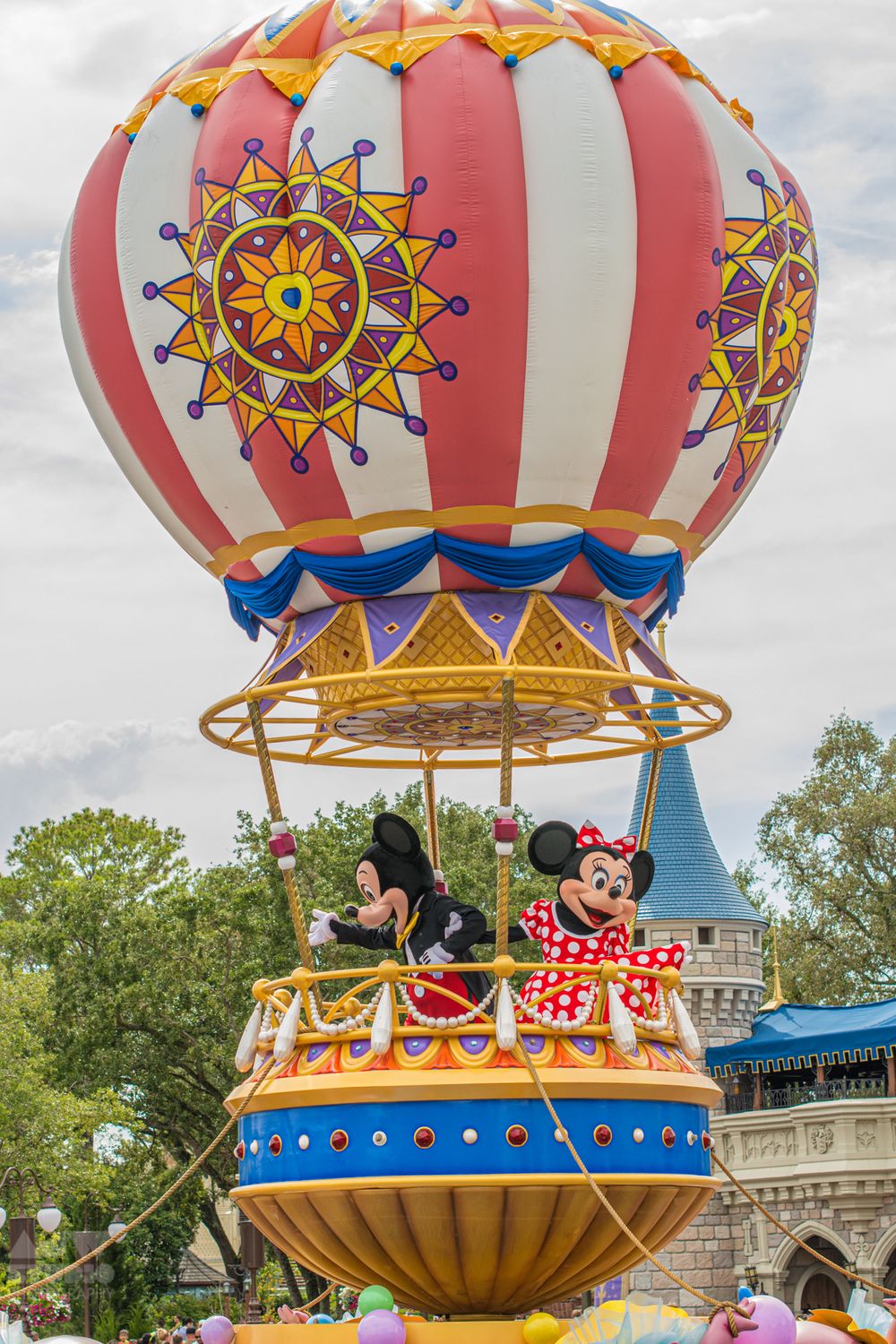 Decorative hot air balloon ride featuring cartoon characters at Disney theme park.