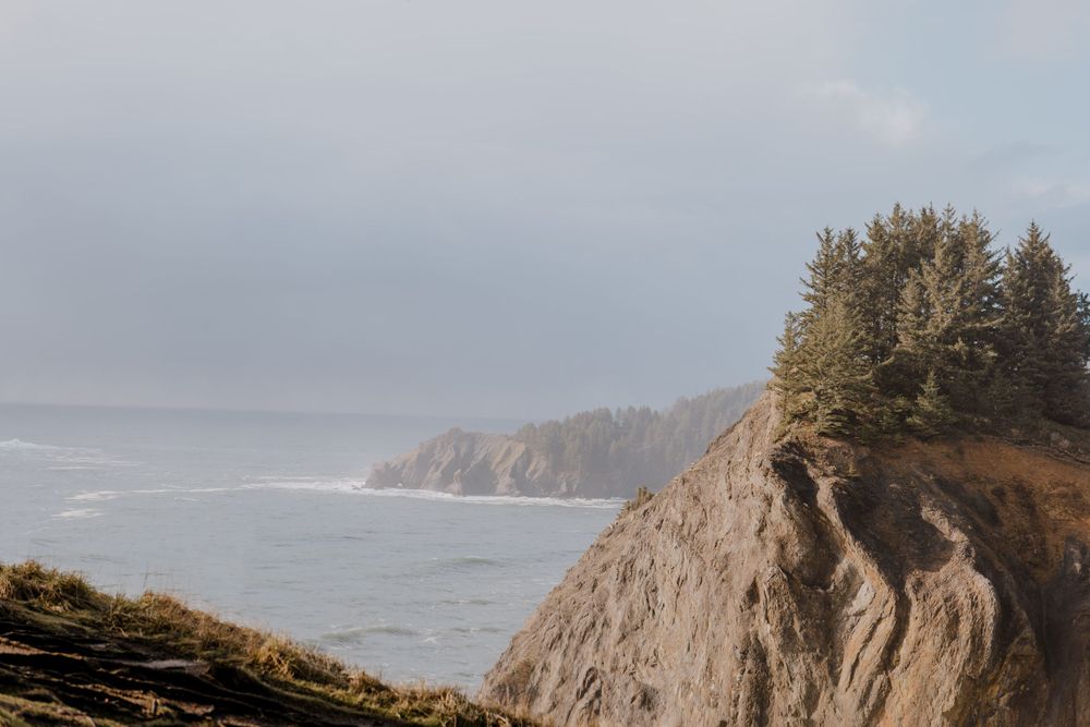Cliffside on the oregon coast with fog in the horizon