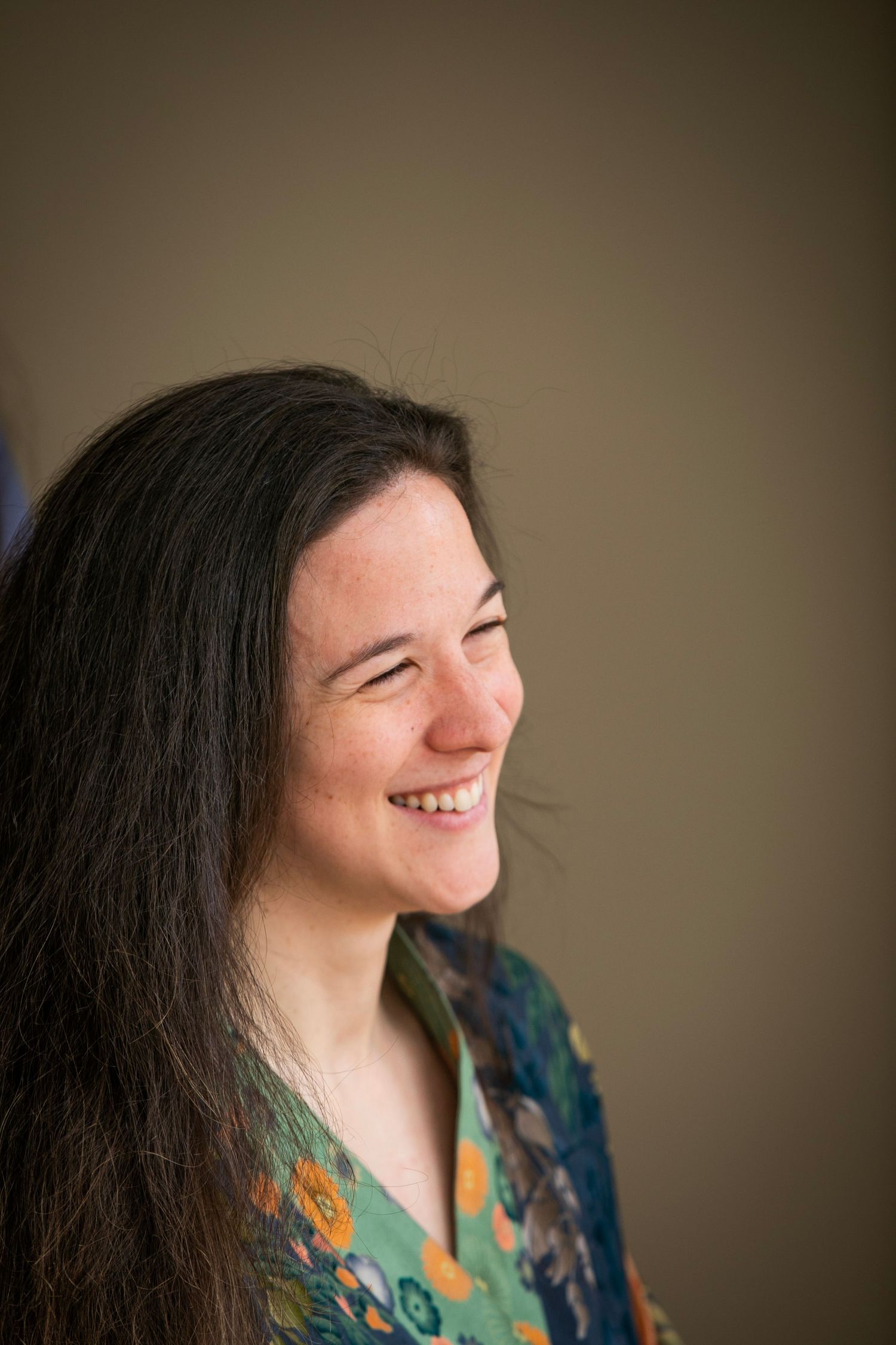 Portrait series showing joyful expressions against neutral background.