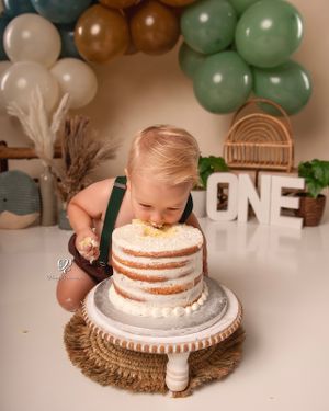 1 year old birthday pictures baby smashing face in cake; boho cake smash session boy; Lexington, SC Cake Smash photos