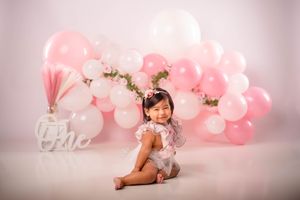 Pink & white balloon arch birthday photoshoot; indoor Cake Smash session; Baby girl one year photoshoot; Lexington, SC