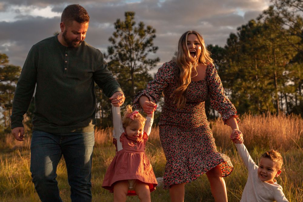 Candid family moment in field in Stuart, Florida