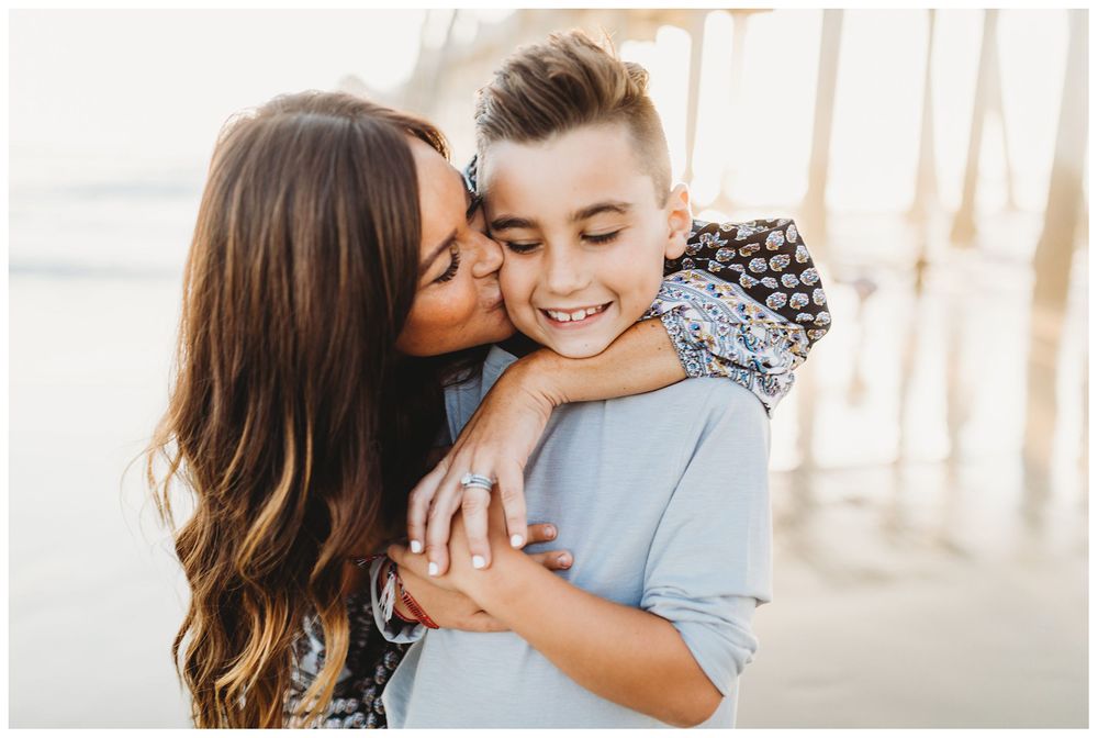 mom kissing son's cheek