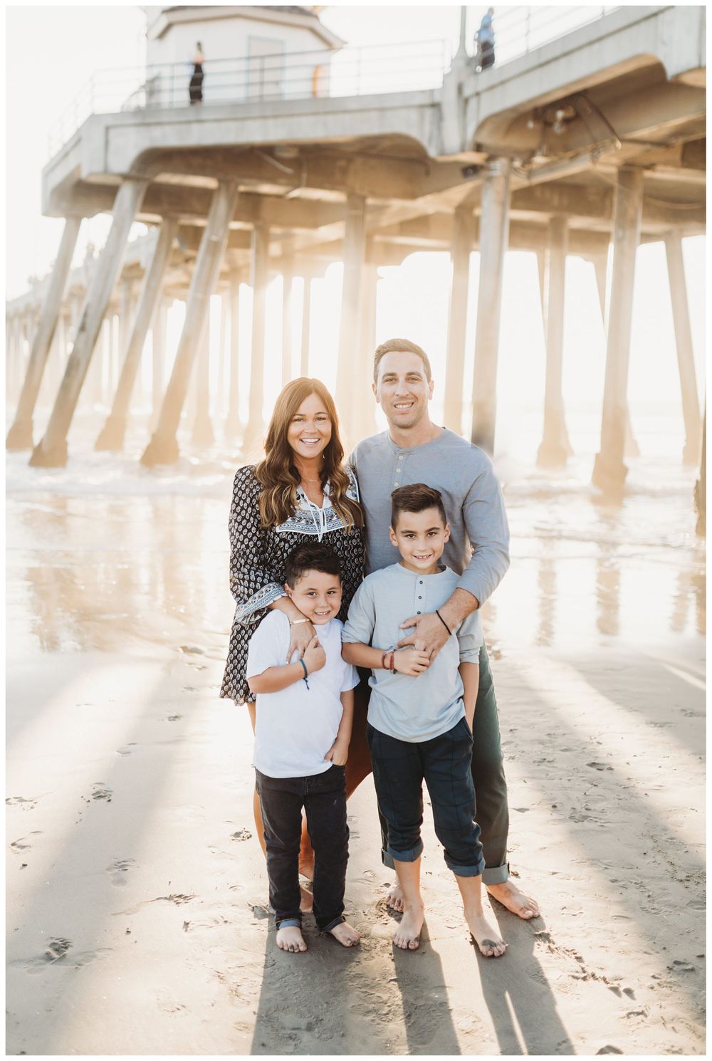 family smiling on beach