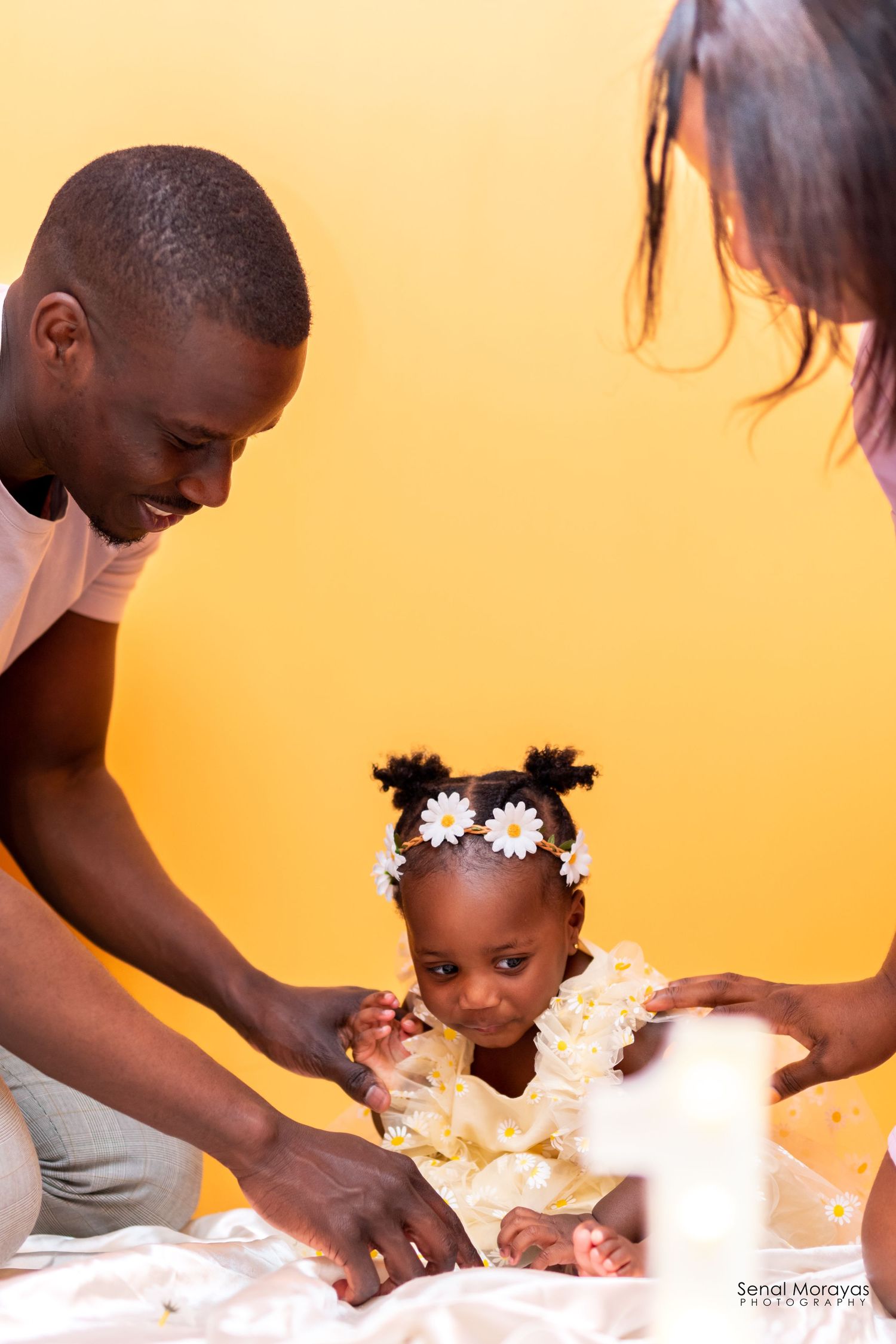 Cake smash photography session showing playful moments with frosting and decorations.