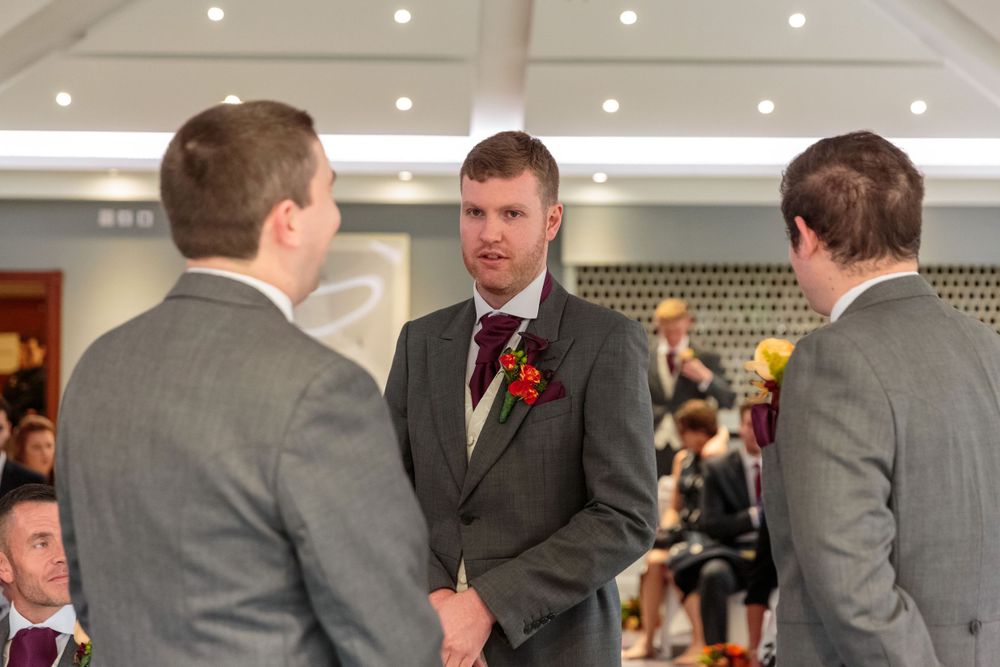 groom waiting for the bride at the altar with his best men