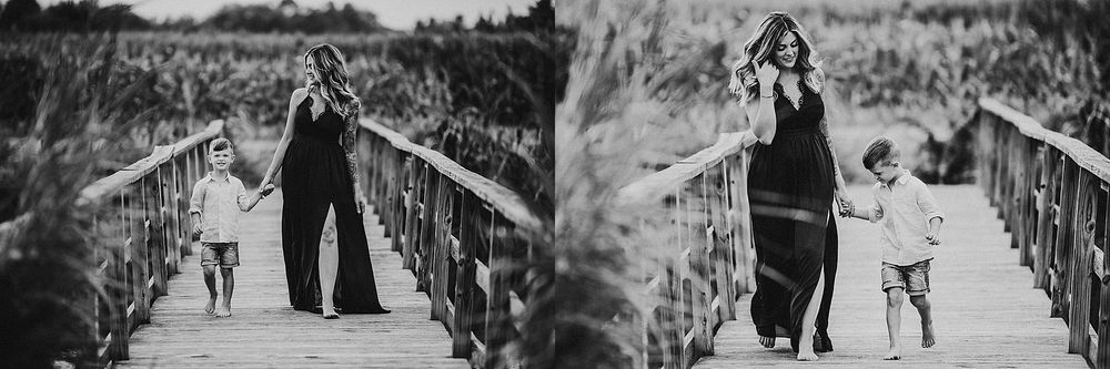 Black and white images of figures walking along a wooden boardwalk through marshland.