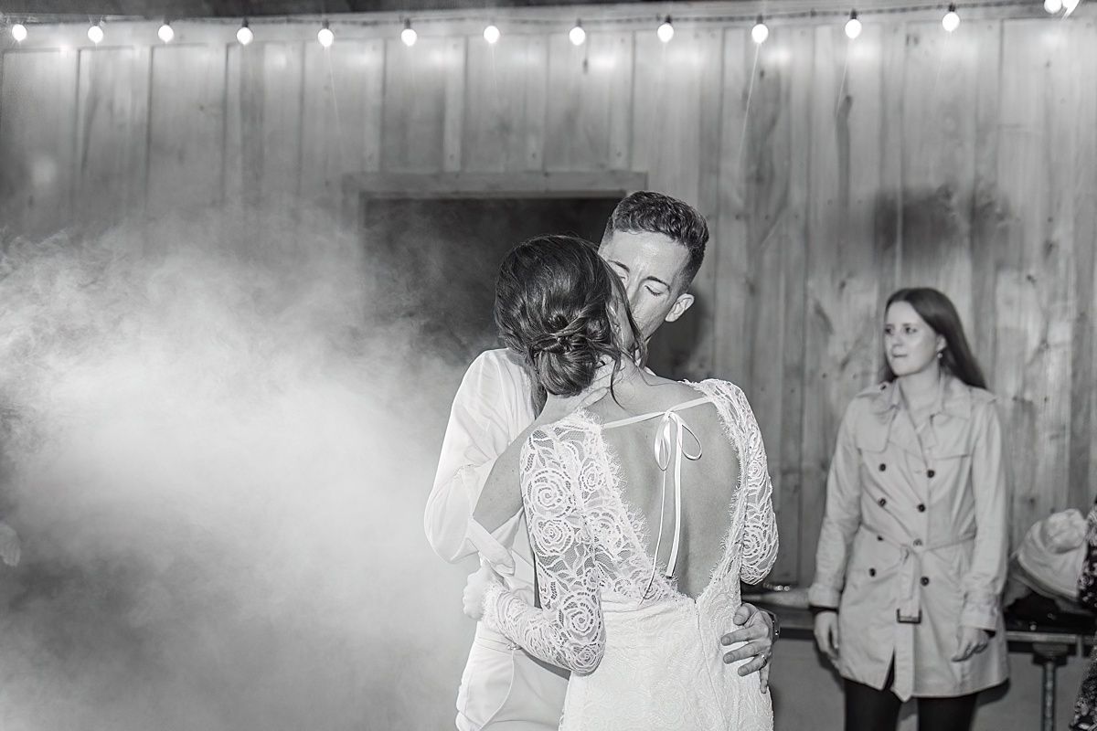 Photography of Bride and groom kissing while dancing at wedding reception