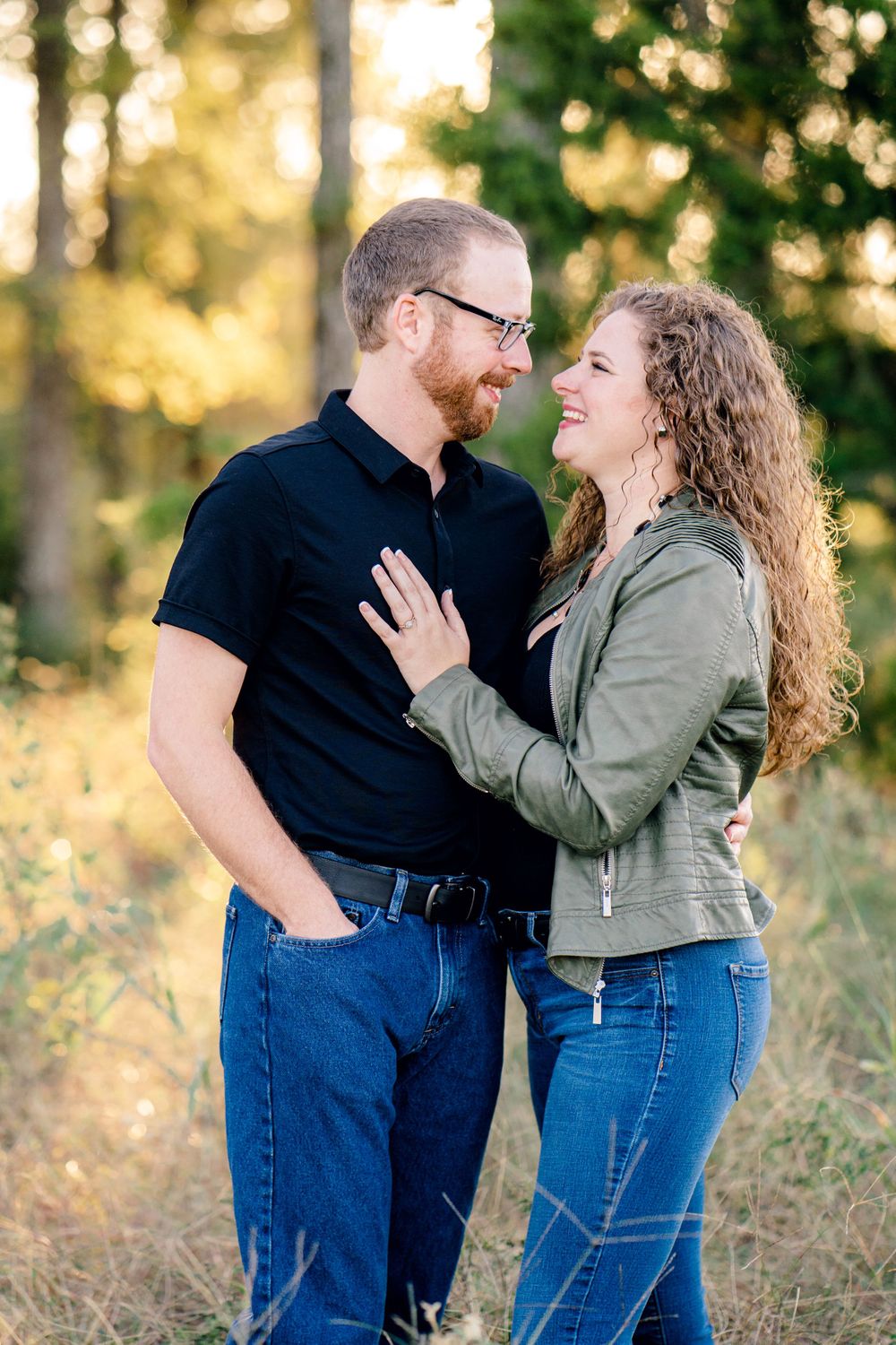 Couple sharing a lighthearted moment together in a natural outdoor setting.