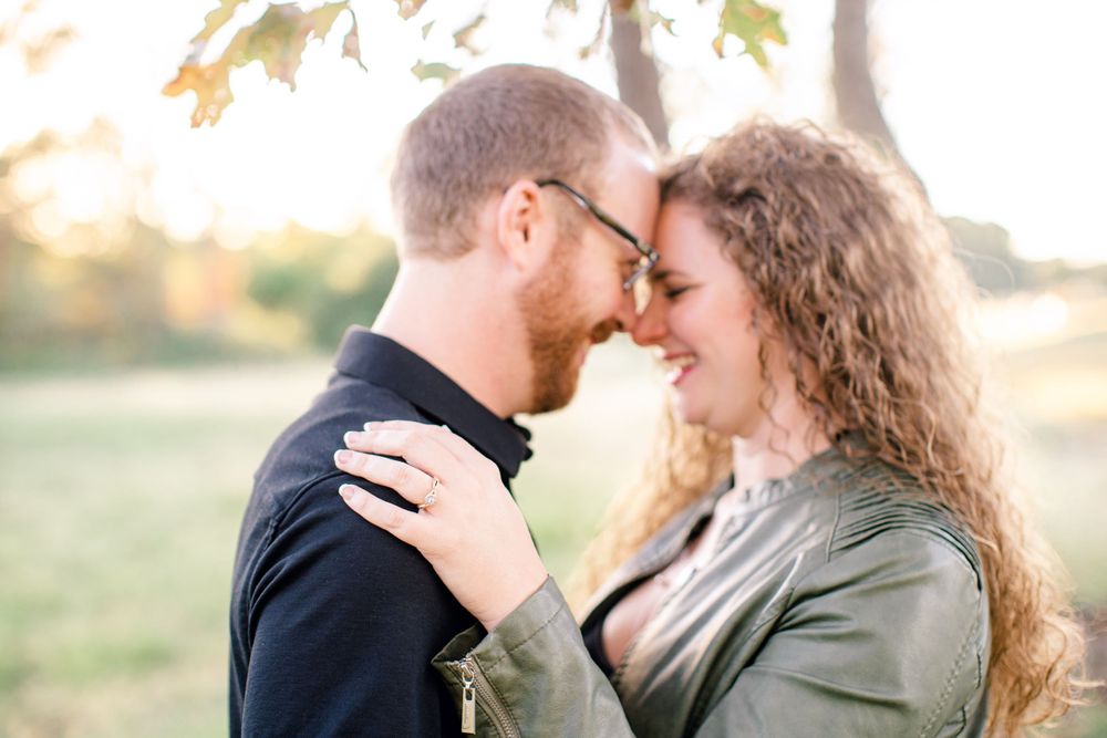 Intimate close-up of a couple sharing a tender moment in warm afternoon light.