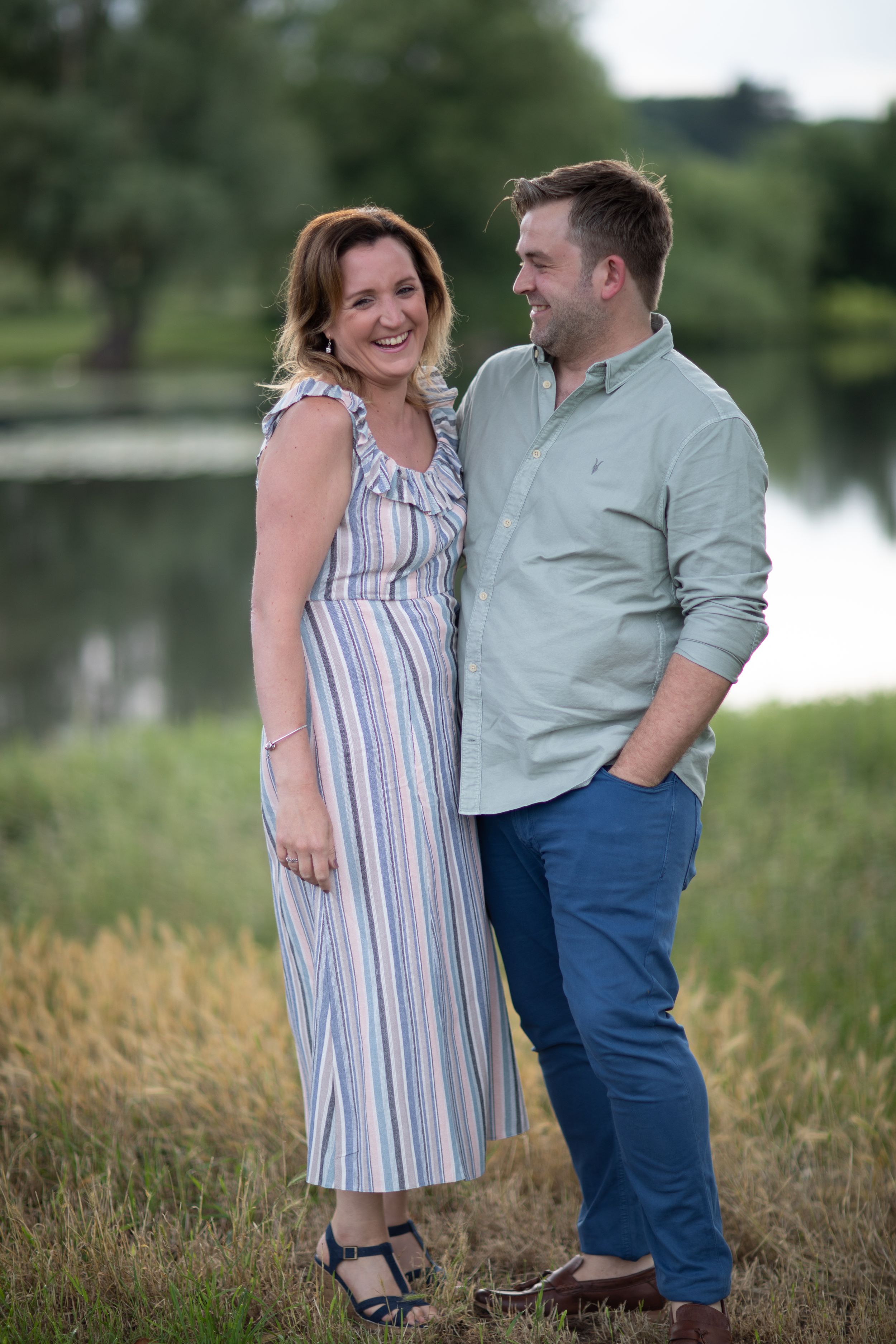 giggling couple at pre wedding engagement photoshoot