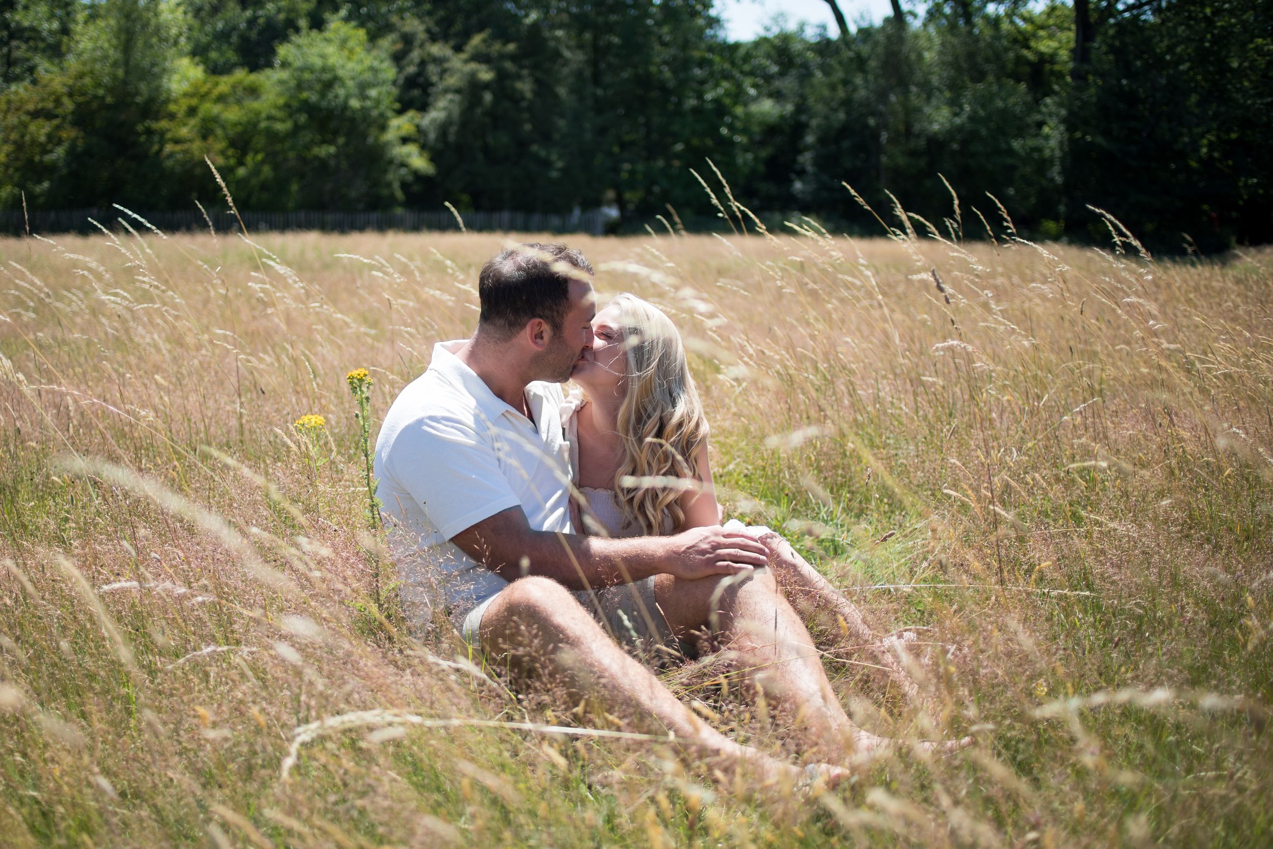 Engaged couple in woodlands