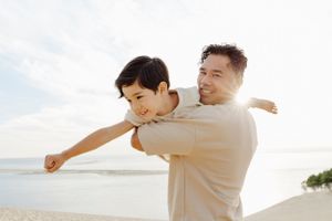 A series of playful outdoor photos showing family interaction against a bright sky.