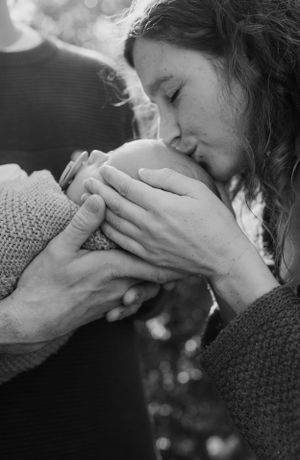 An intimate black and white portrait sequence showing tender moments.