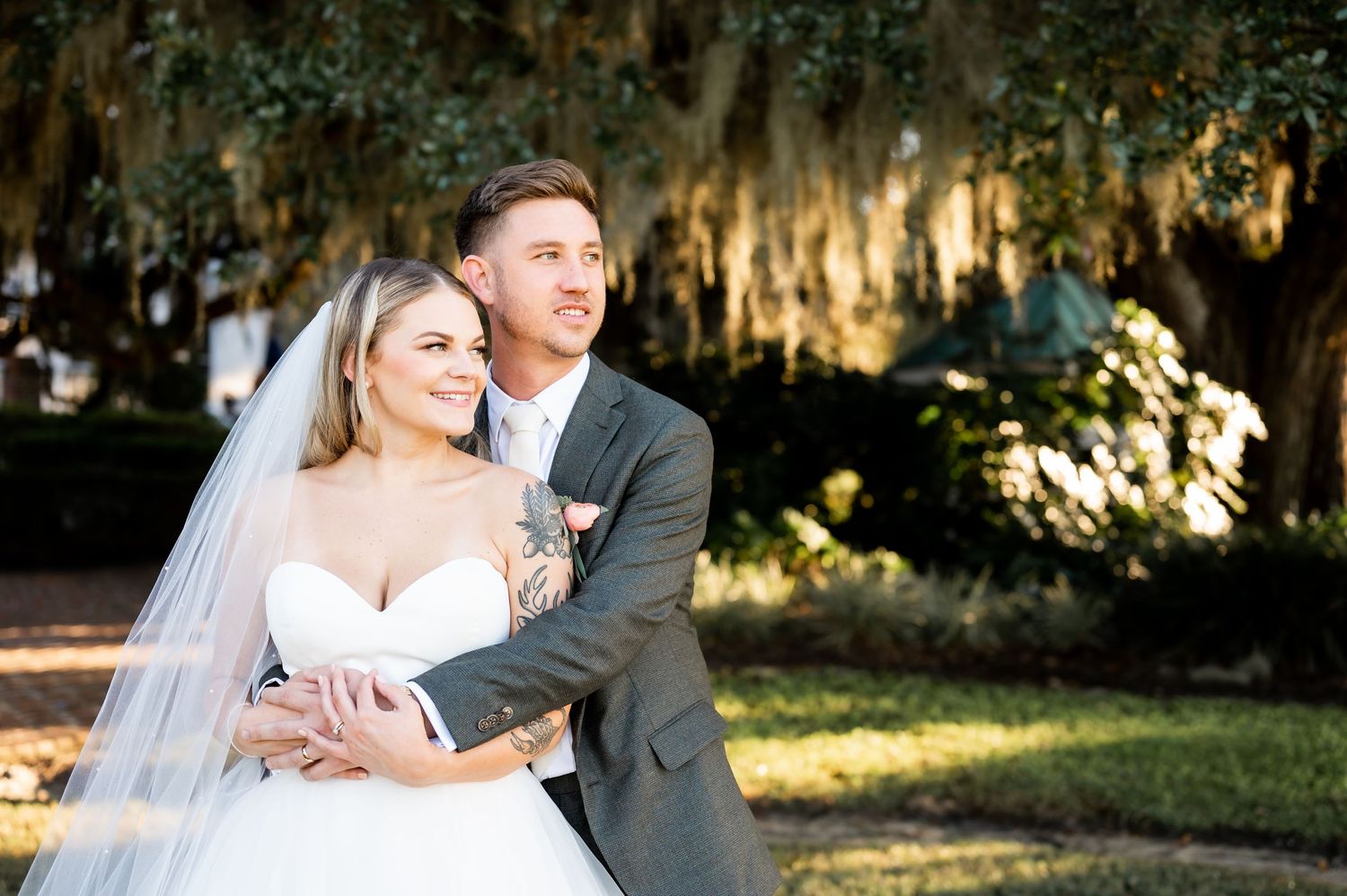 Newlyweds share tender moments during their sunset garden wedding photoshoot.