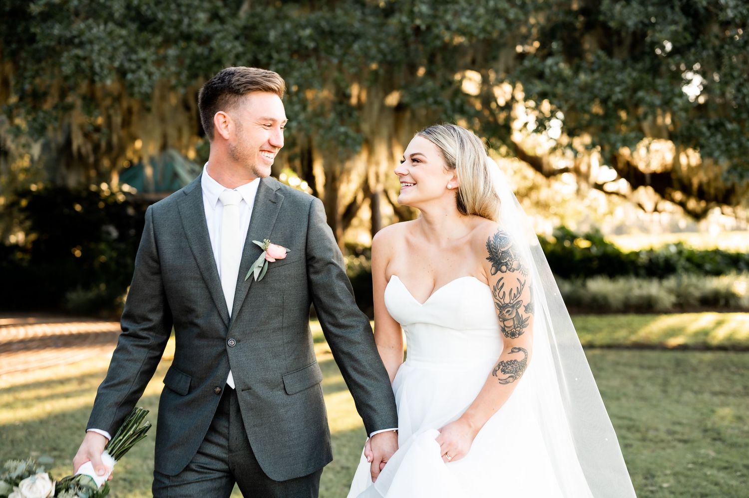 Newlyweds share intimate moments during their outdoor wedding photography session.