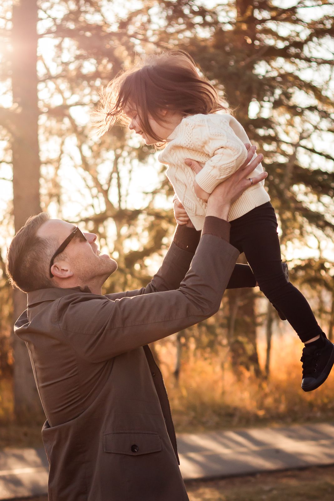 Beautiful father daughter moment during golden hour fall photo session with Love & Sunshine Photography.